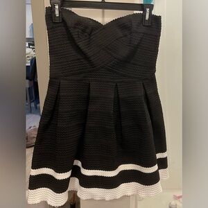 New, Never Worn Elegant Black Dress Featuring A Sweetheart Top and White Trim.